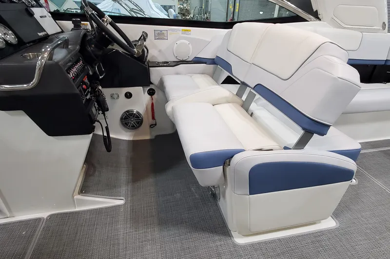  Yacht Photos Pics 2020 Formula 310 Bowrider interior with dual helm seats and modern dashboard.