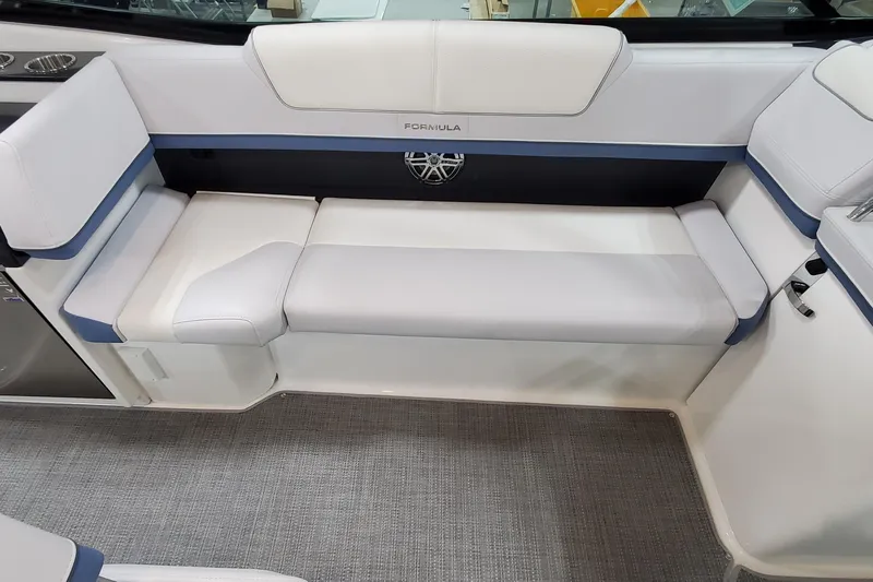  Yacht Photos Pics 2020 Formula 310 Bowrider interior seating with white and blue upholstery.