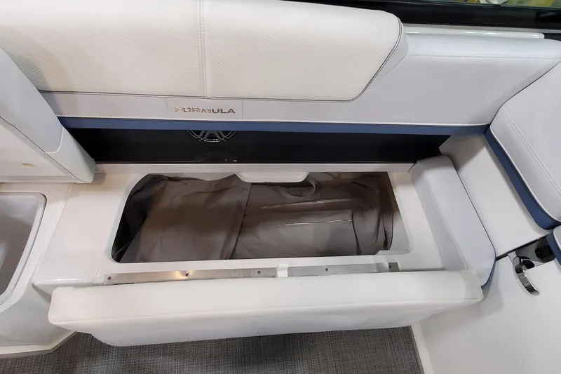  Yacht Photos Pics 2020 Formula 310 Bowrider interior storage compartment with open seat cushion.