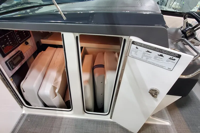  Yacht Photos Pics 2020 Formula 310 Bowrider storage compartment with cushions and control panel.
