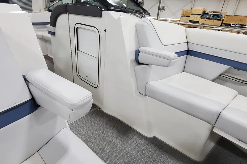  Yacht Photos Pics 2020 Formula 310 Bowrider interior with white seating and blue accents.