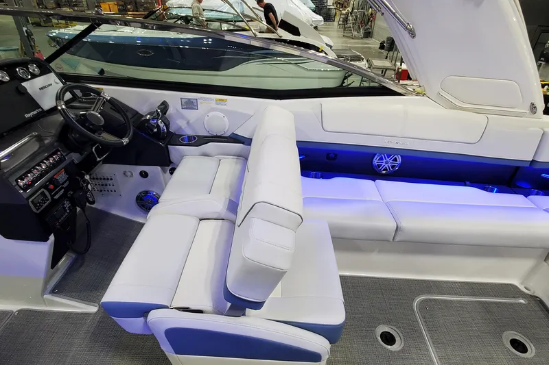  Yacht Photos Pics 2020 Formula 310 Bowrider interior with white seating and modern dashboard.