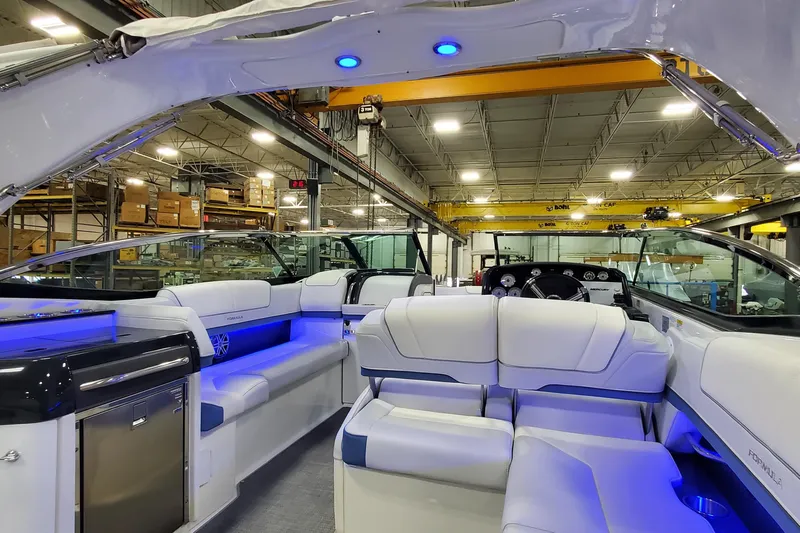  Yacht Photos Pics 2020 Formula 310 Bowrider interior with luxurious seating and ambient blue lighting.