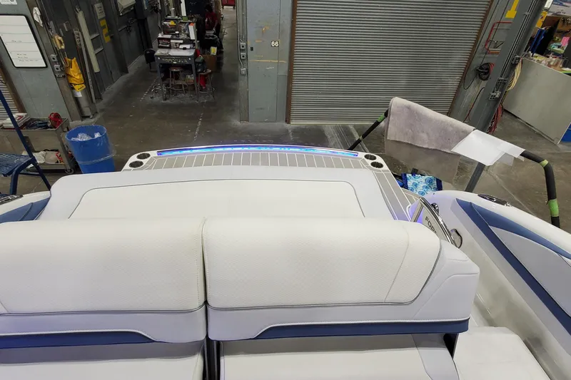  Yacht Photos Pics 2020 Formula 310 Bowrider interior with white seating in a workshop setting.