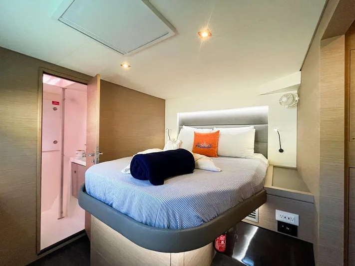 Wanderlust Yacht Photos Pics Interior cabin of 2020 Fountaine Pajot Saona 47 catamaran, featuring a cozy bed and modern design.