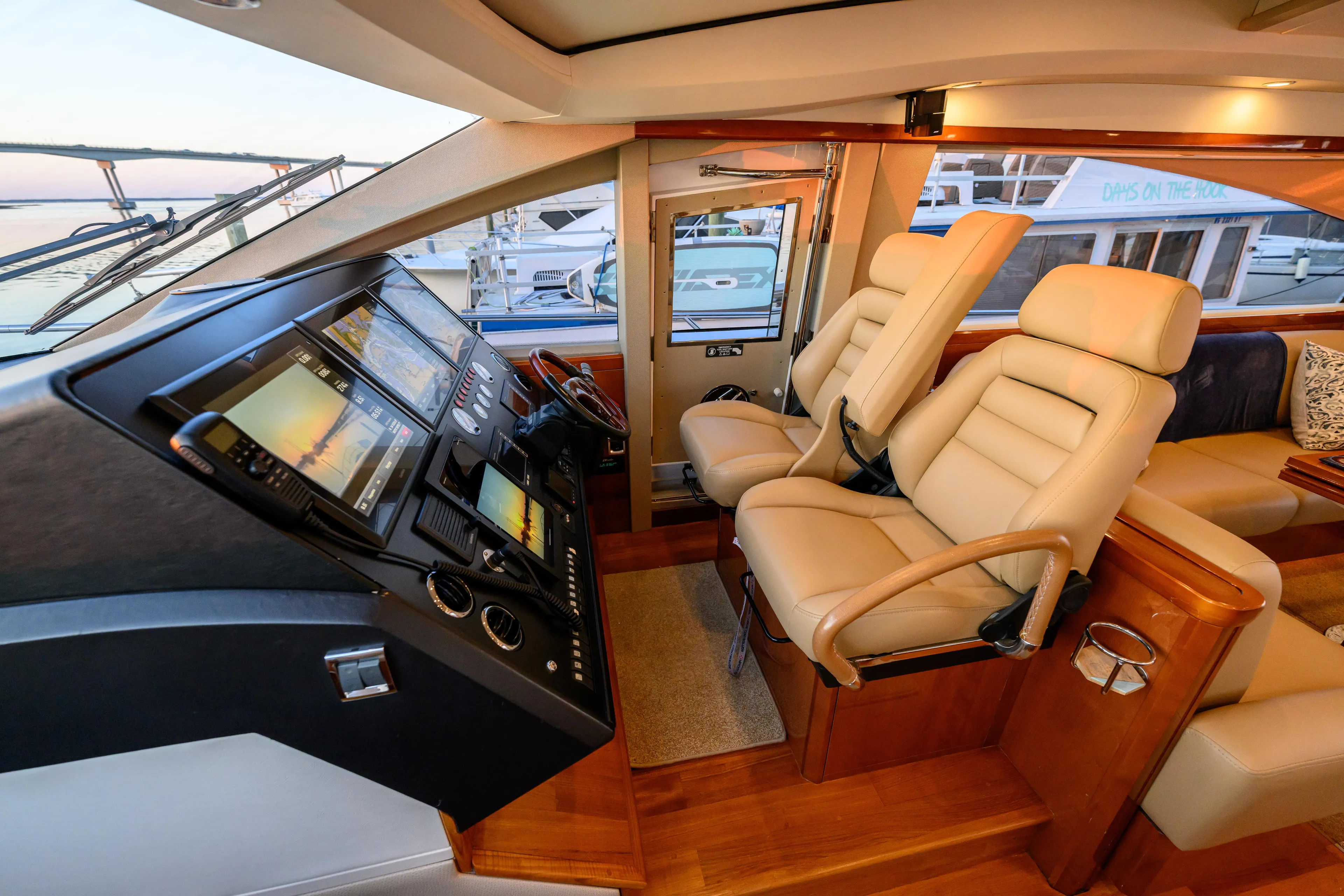 Endless Summer Yacht Photos Pics Luxurious interior of 2006 Princess V65 yacht with leather seating and advanced navigation controls.