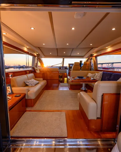 Endless Summer Yacht Photos Pics Luxurious interior of a 2006 Princess V65 yacht with elegant seating and ambient lighting.