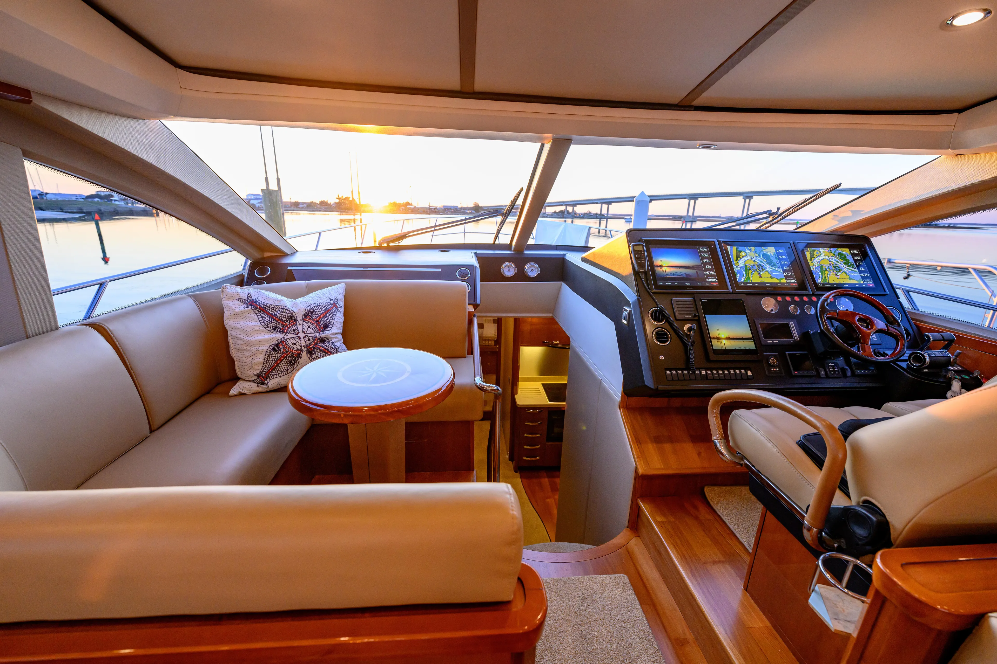Endless Summer Yacht Photos Pics Luxurious 2006 Princess V65 yacht interior with helm, seating, and sunset view.