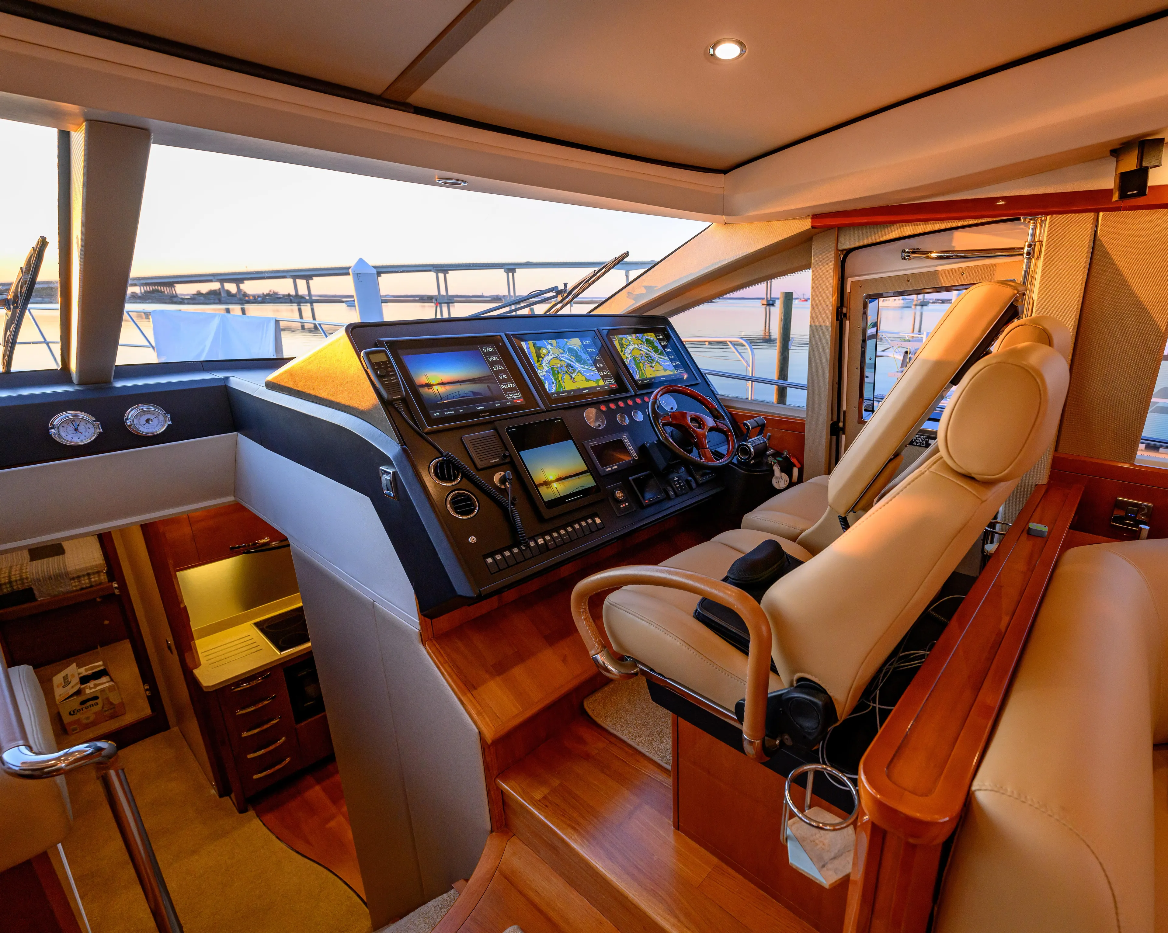 Endless Summer Yacht Photos Pics Luxurious 2006 Princess V65 yacht cockpit with advanced navigation systems and plush seating.