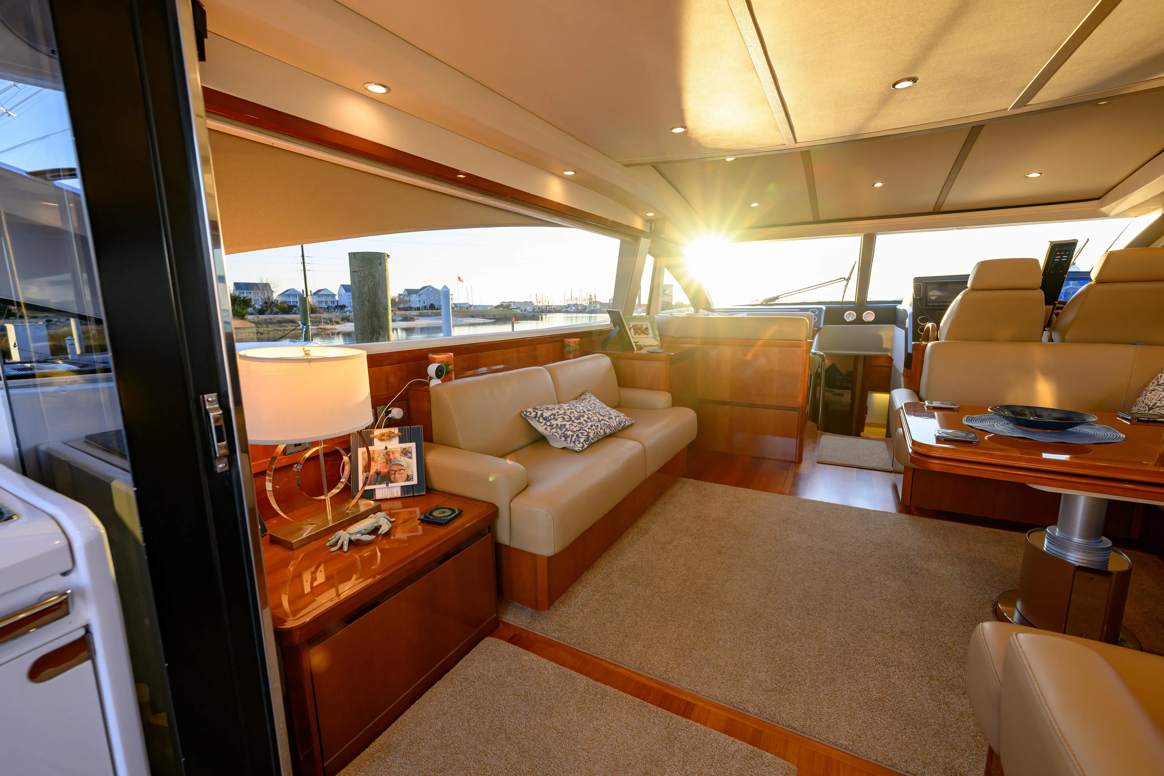 Endless Summer Yacht Photos Pics Luxurious 2006 Princess V65 yacht interior with elegant seating and sunset view.