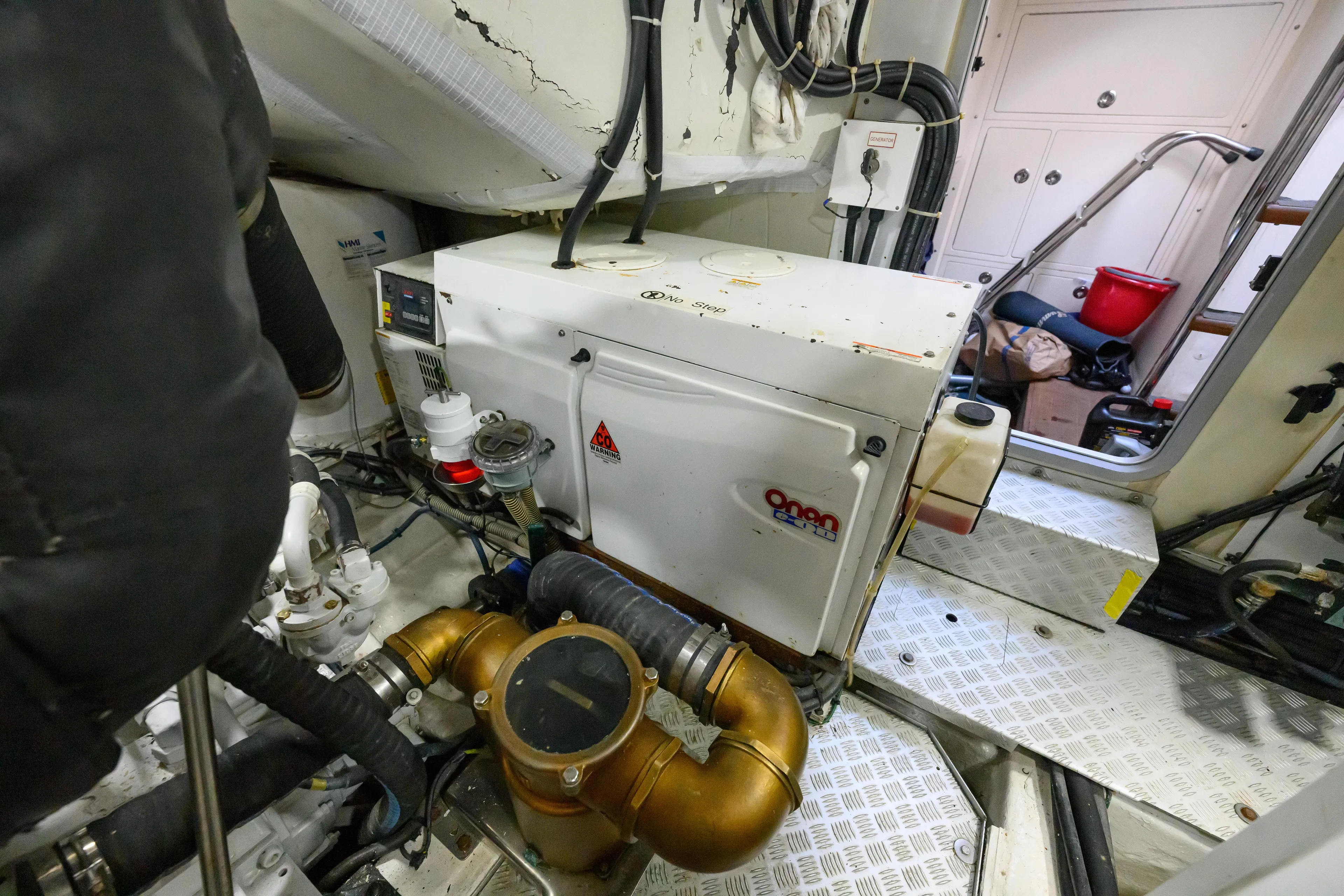 Endless Summer Yacht Photos Pics Engine room of 2006 Princess V65 yacht with Onan generator and mechanical components.