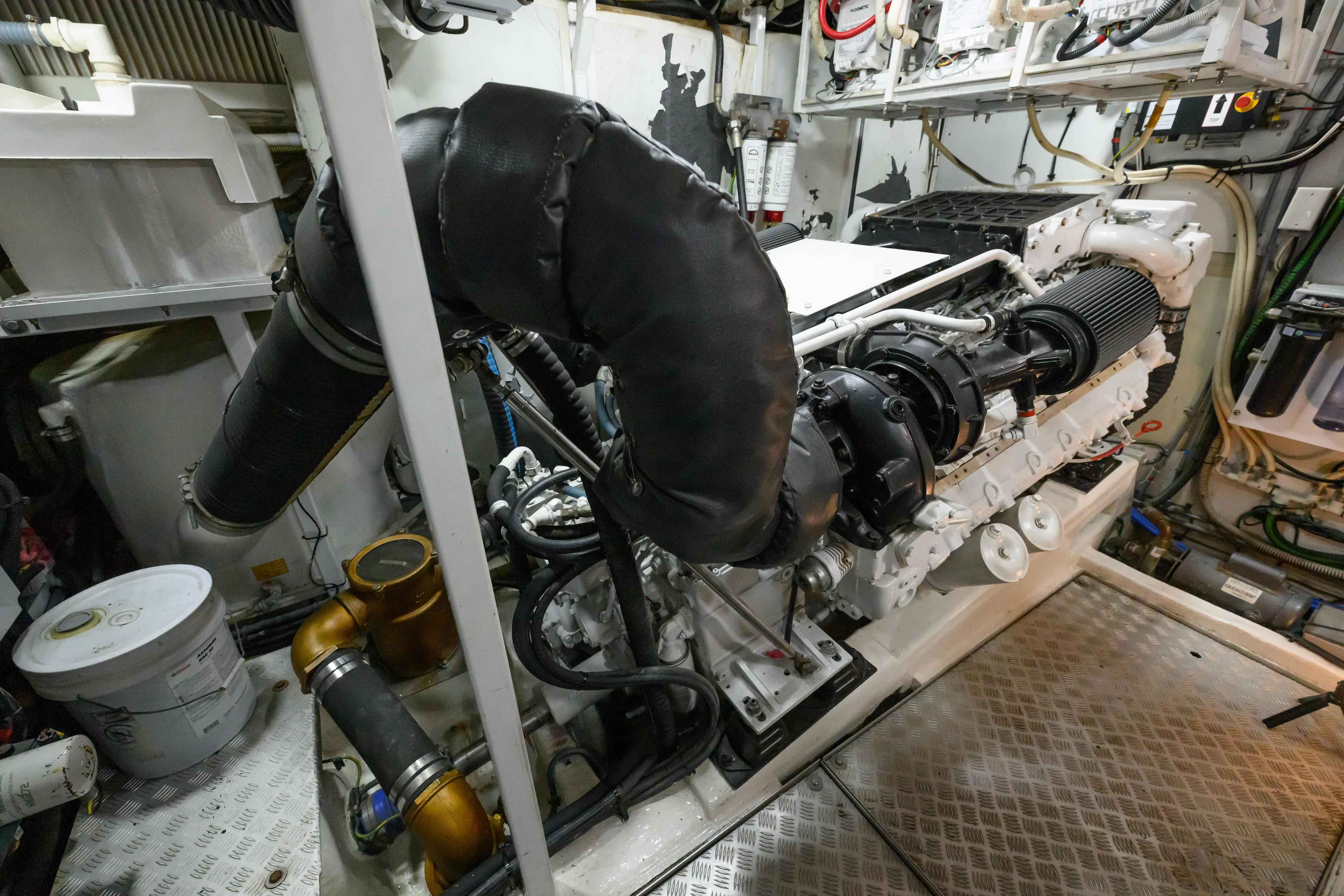 Endless Summer Yacht Photos Pics Engine room of 2006 Princess V65 yacht, showcasing mechanical components and piping.