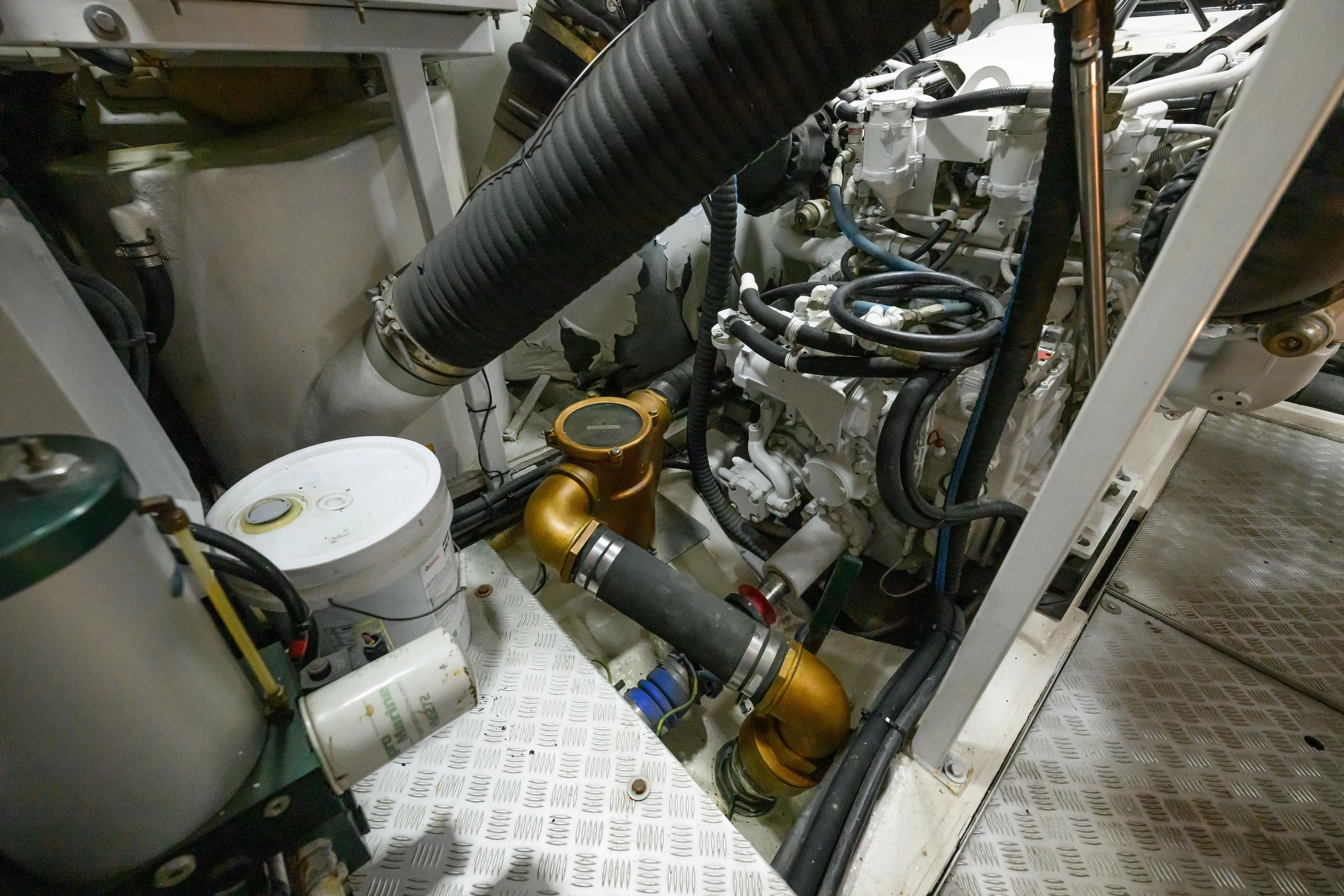 Endless Summer Yacht Photos Pics Engine room of 2006 Princess V65 yacht, showcasing mechanical components and piping.