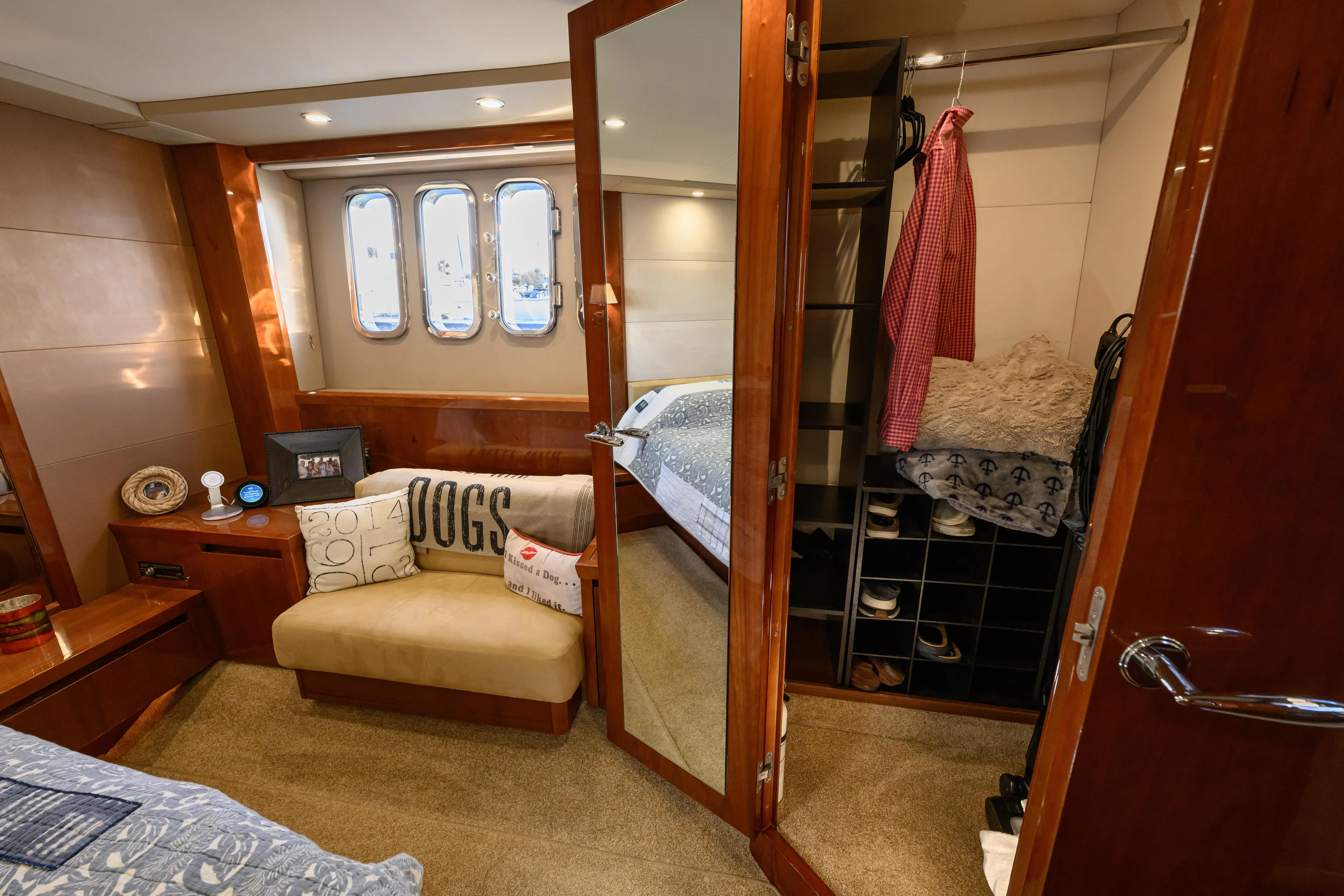 Endless Summer Yacht Photos Pics Luxurious 2006 Princess V65 yacht cabin with cozy seating and elegant wood finishes.