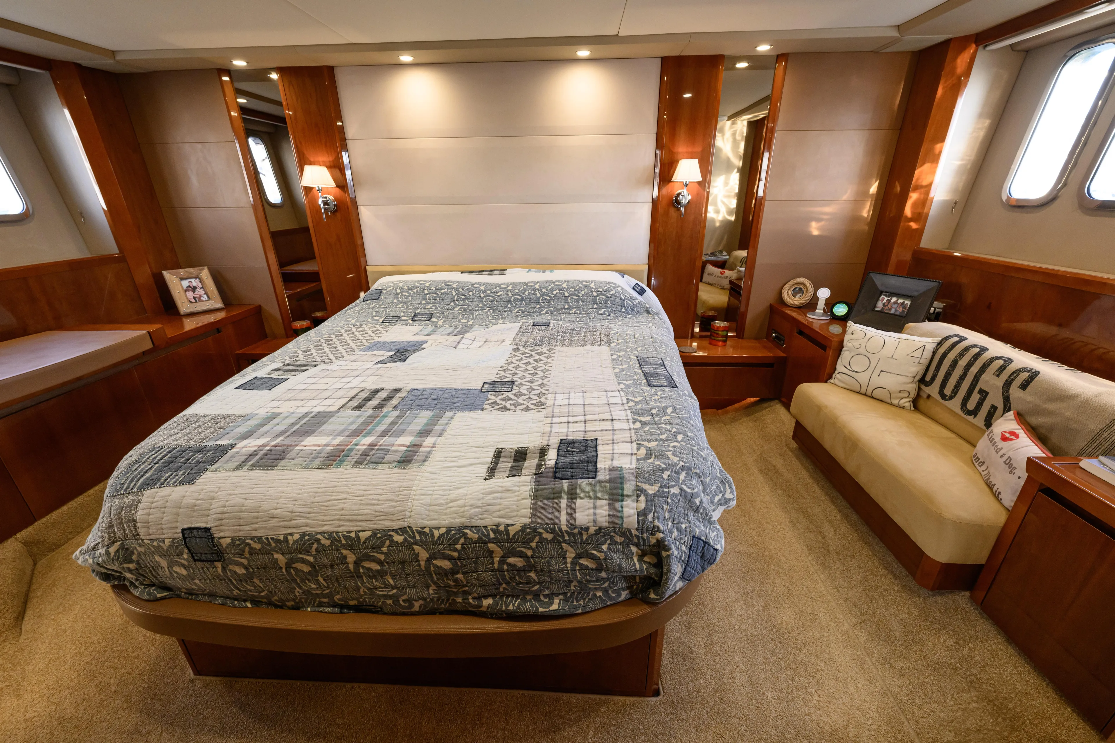 Endless Summer Yacht Photos Pics Luxurious bedroom interior of 2006 Princess V65 yacht with elegant decor and comfortable bedding.