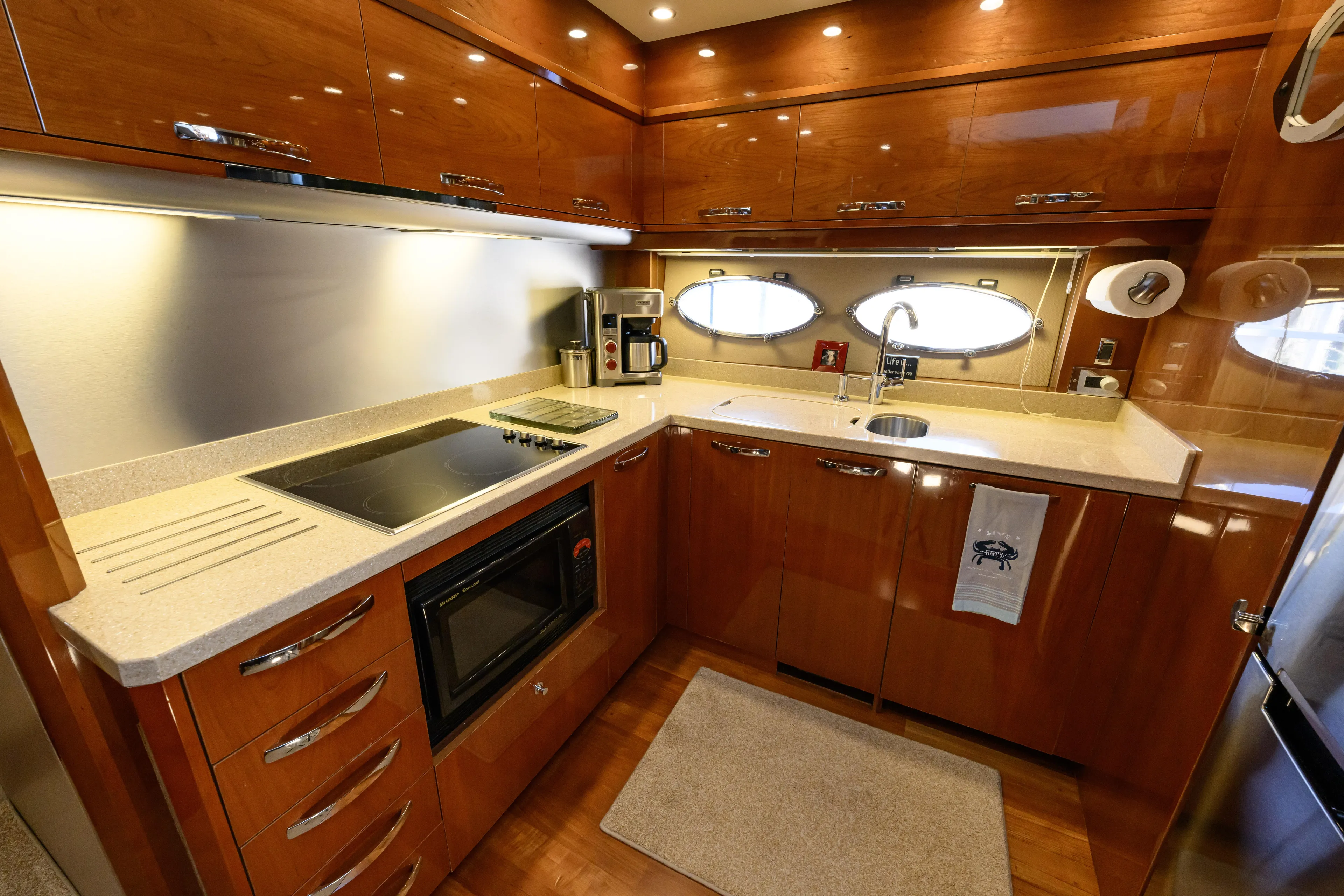 Endless Summer Yacht Photos Pics Luxurious kitchen interior of a 2006 Princess V65 yacht with modern appliances.