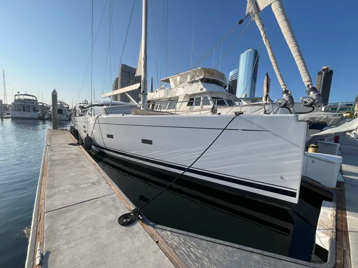 Crosswind Yacht Photos Pics 2016 Moody 54 DS yacht docked at marina with city skyline.