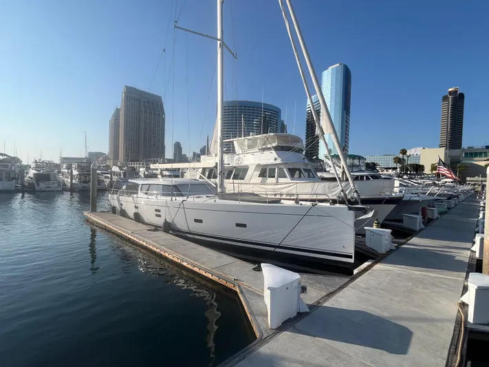 Crosswind Yacht Photos Pics Moody 54 DS 2016 yacht docked in a marina with city skyline backdrop.