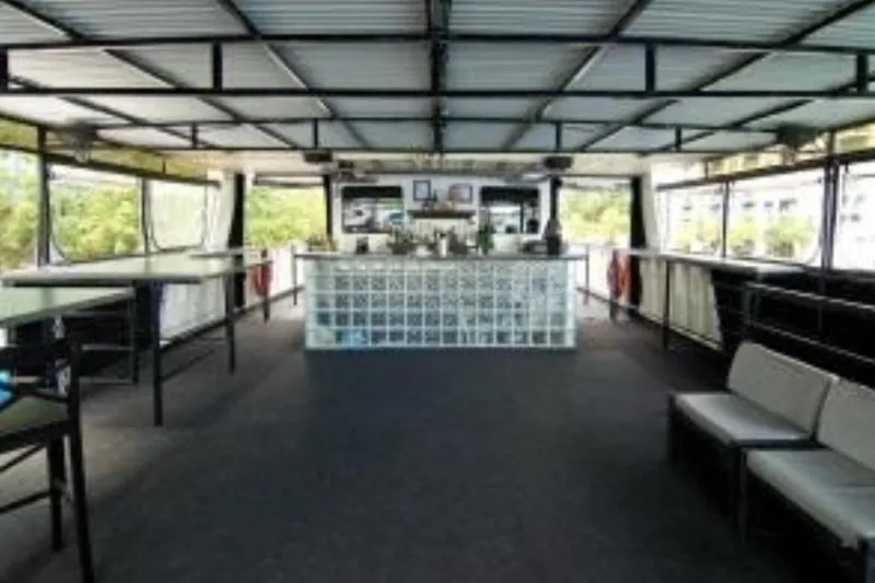 Klancy II Yacht Photos Pics Interior of 1989 Kanter 66 yacht with modern bar and seating area.