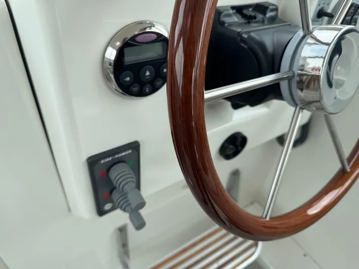 Change Of Pace Yacht Photos Pics Steering wheel and controls of a 2008 Back Cove 29 Hardback boat.