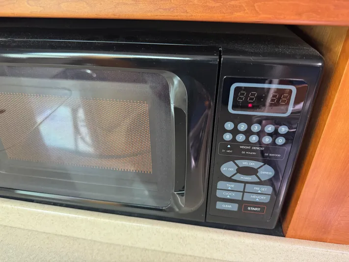 Change Of Pace Yacht Photos Pics Microwave oven in 2008 Back Cove 29 Hardback boat kitchen area.