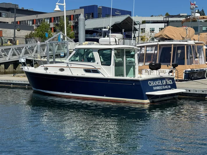 Change Of Pace Yacht Photos Pics 2008 Back Cove 29 Hardback boat docked at a marina, featuring a sleek design.