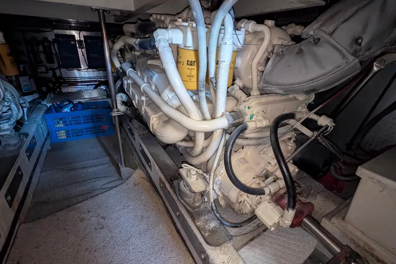 Fisher Folly IV Yacht Photos Pics Engine room of 1988 Offshore Yachts 48 Yachtfisher, featuring a CAT engine.