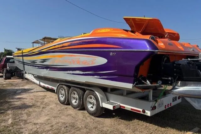 Yacht Photos Pics 2008 Nor-Tech 3600 Supercat powerboat with vibrant orange and purple design on a trailer.