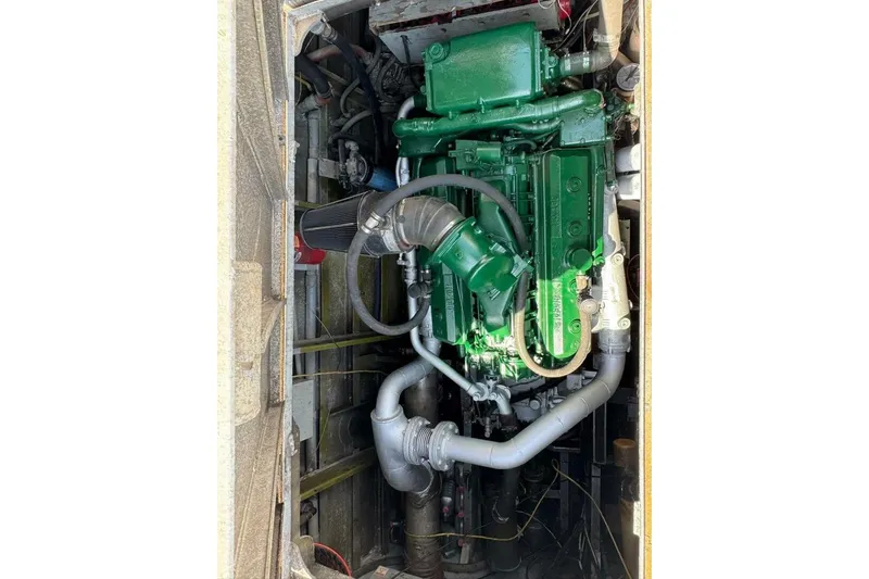  Yacht Photos Pics Green engine in a 1964 custom commercial vehicle, showcasing intricate piping and components.