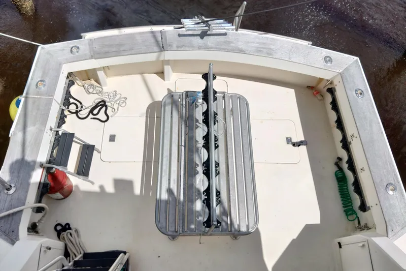  Yacht Photos Pics 1999 Viking 45 Convertible boat deck with fishing rod holders and equipment.