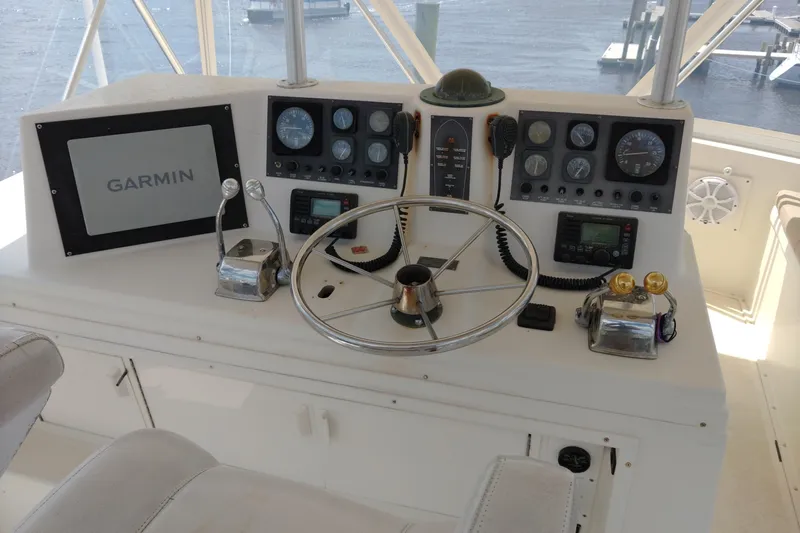  Yacht Photos Pics Helm of 1999 Viking 45 Convertible with Garmin navigation system and control panel.