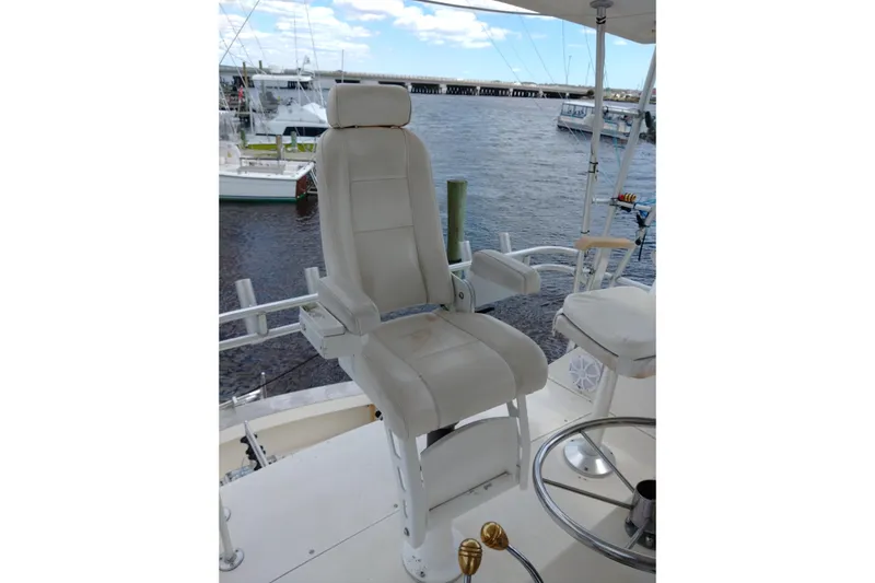  Yacht Photos Pics Captain's chair on 1999 Viking 45 Convertible yacht, overlooking marina.