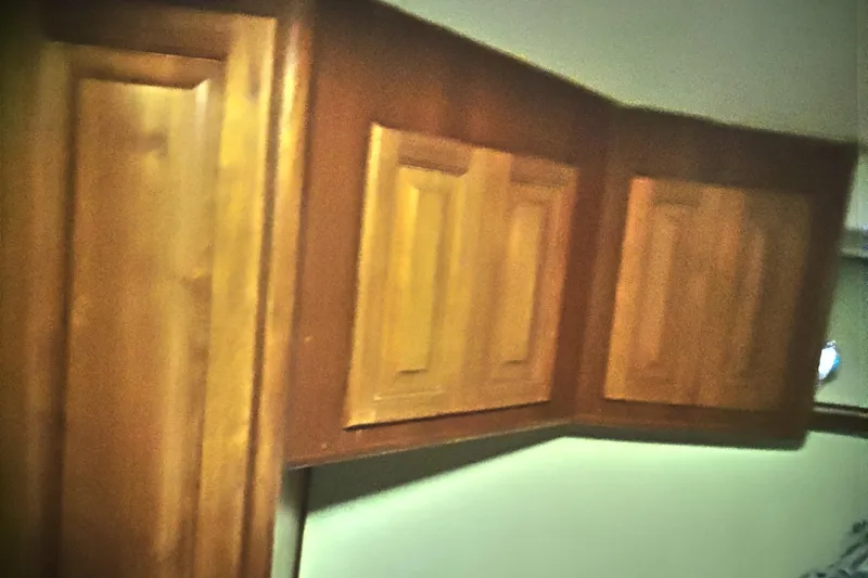  Yacht Photos Pics Wooden cabinetry inside a 1999 Viking 45 Convertible boat interior.