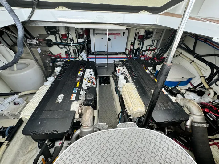 Lovely Day Yacht Photos Pics Engine room of a 2009 Formula 45 Yacht, showcasing dual engines and mechanical components.