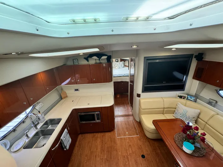 Lovely Day Yacht Photos Pics Interior of 2009 Formula 45 Yacht with kitchen, seating area, and modern amenities.