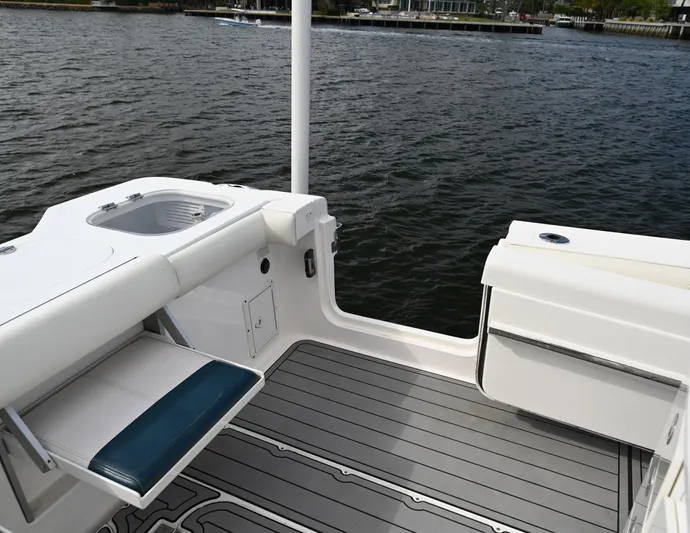  Yacht Photos Pics 2013 Everglades 325 Center Console boat interior with seating and water view.