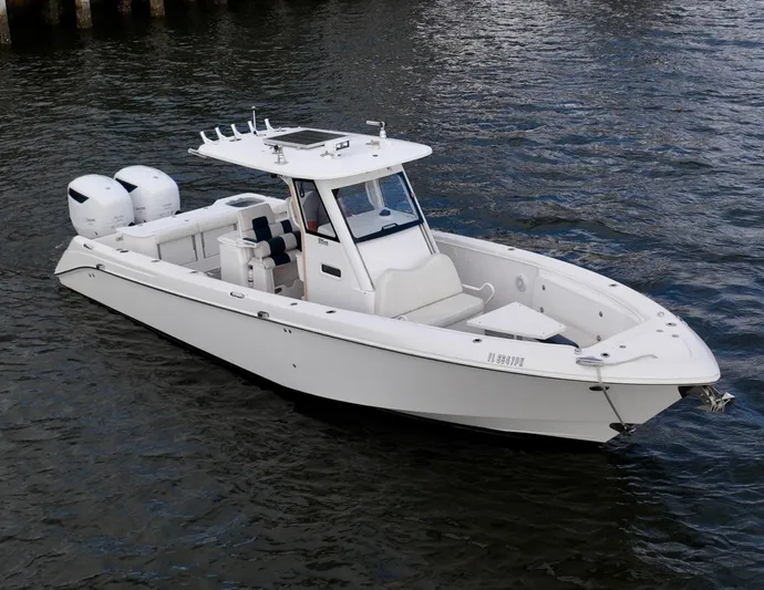  Yacht Photos Pics 2013 Everglades 325 Center Console boat on water, featuring twin engines and sleek design.