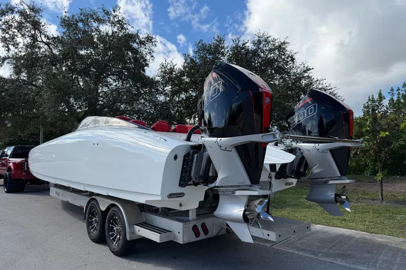  Yacht Photos Pics 2022 Doug Wright 320 boat with dual outboard engines on a trailer.