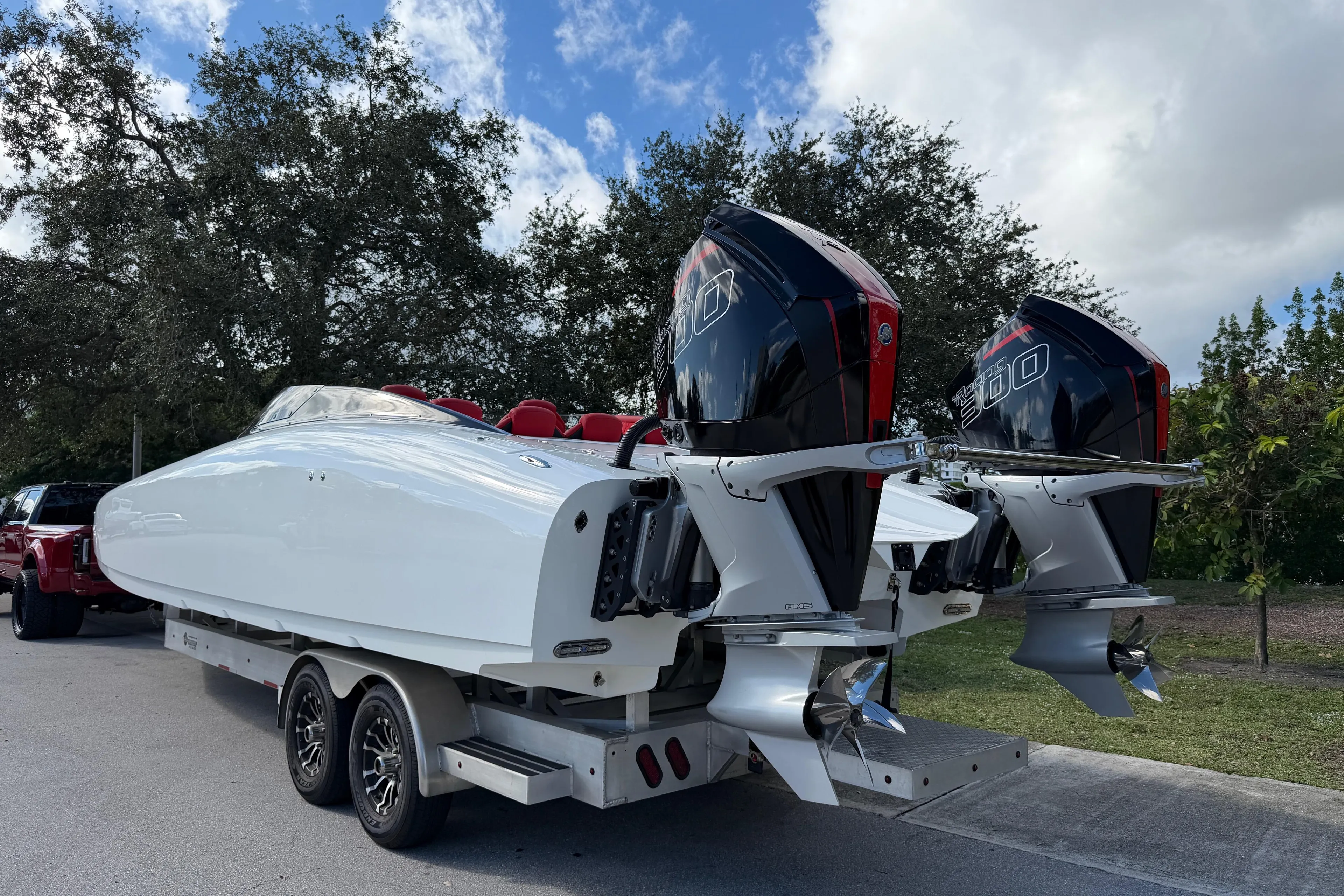 2022 Doug Wright 320 boat with dual outboard engines on a trailer.