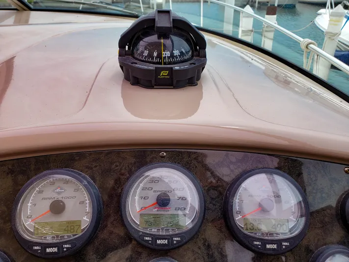  Yacht Photos Pics Dashboard of 2004 Cruisers Yachts 340 Express with compass and gauges.