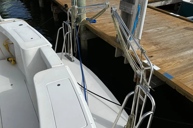 Chapter 2 Yacht Photos Pics 1998 Mainship 350 Trawler docked, showcasing deck and mooring lines.