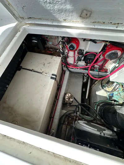 Chapter 2 Yacht Photos Pics Engine compartment of a 1998 Mainship 350 Trawler, showing wiring and mechanical components.