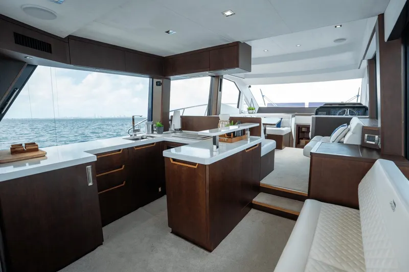  Yacht Photos Pics Luxurious interior of 2020 Galeon 500 Fly yacht with modern kitchen and seating area.