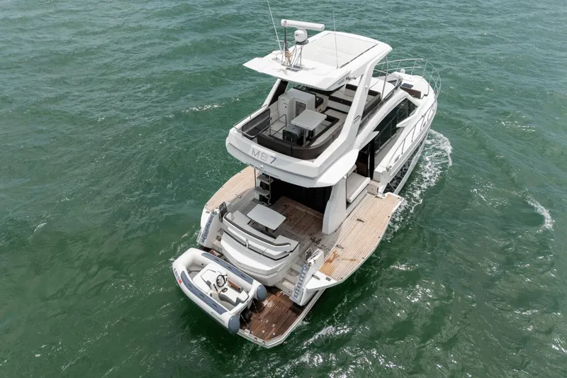  Yacht Photos Pics 2020 Galeon 500 Fly yacht cruising on open water, rear view.