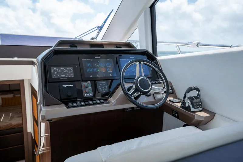  Yacht Photos Pics Helm of 2020 Galeon 500 Fly yacht with modern navigation controls and steering wheel.