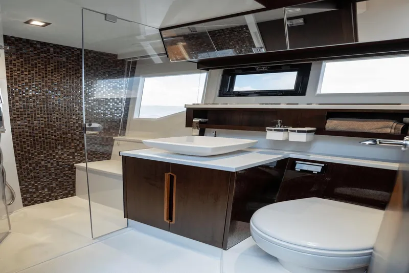  Yacht Photos Pics Luxurious bathroom interior of 2020 Galeon 500 Fly yacht with modern fixtures.