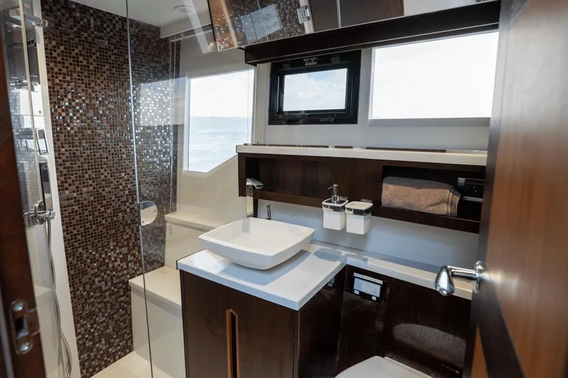  Yacht Photos Pics Luxurious bathroom interior on 2020 Galeon 500 Fly yacht with modern fixtures and mosaic tiles.