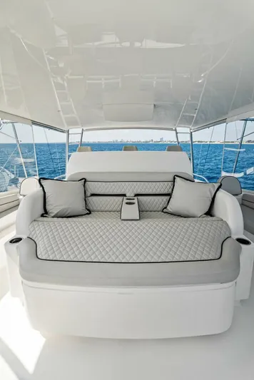Rachel Anne Yacht Photos Pics Luxurious seating area on a 2022 Viking 80 yacht with ocean view.