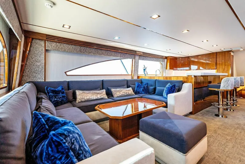 Rachel Anne Yacht Photos Pics Luxurious interior of a 2022 Viking 80 yacht with plush seating and elegant decor.
