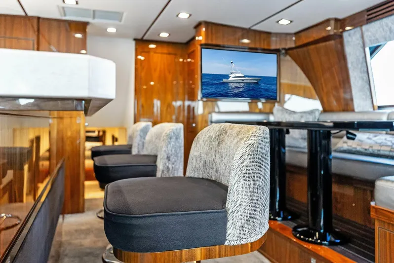 Rachel Anne Yacht Photos Pics Luxurious interior of 2022 Viking 80 yacht with plush seating and modern amenities.